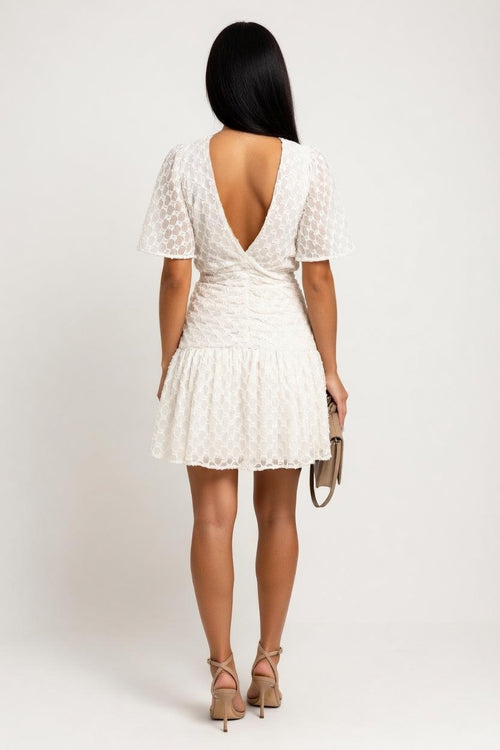 Pleated Check Mini Skirt — back view